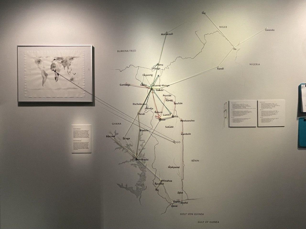 Wall installation of the routes of the colonial military actors on a current map of Togo